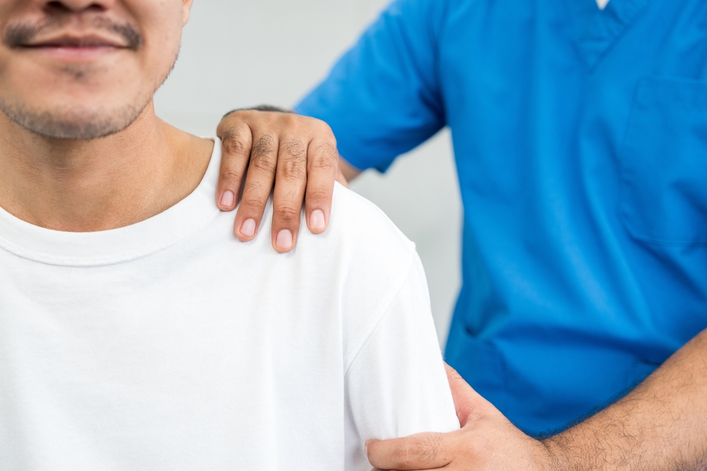 Physical,Therapy.,Male,Nurse,Aids,Young,Man,In,Recovering,From